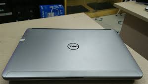 Dell silver laptop with name tag "Nguyen Van A"