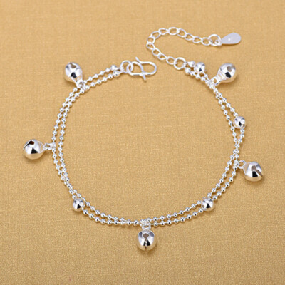 Silver anklet with small bell.