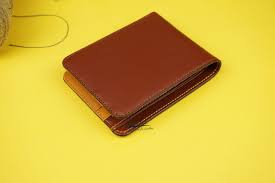 Brown leather wallet with ID card inside